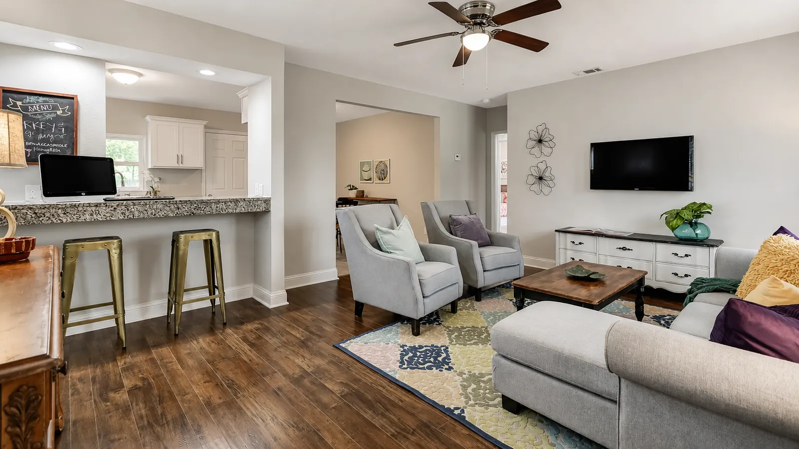 Open-concept living room and kitchen bar interior