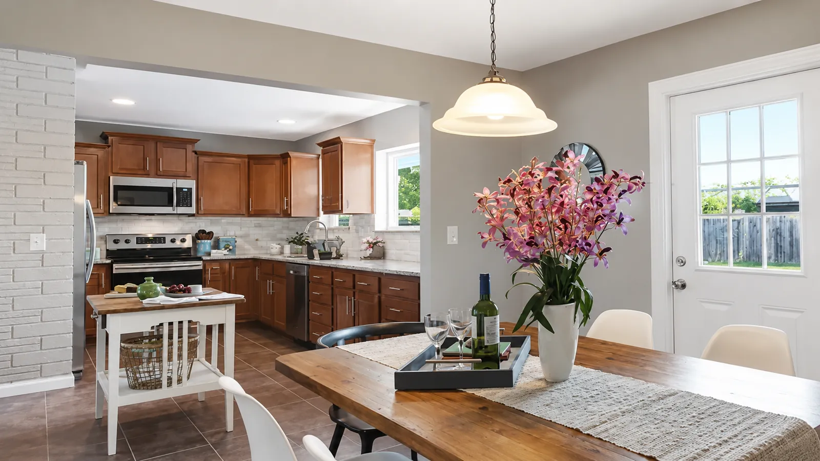 Kitchen and dining area with wood cabinetry